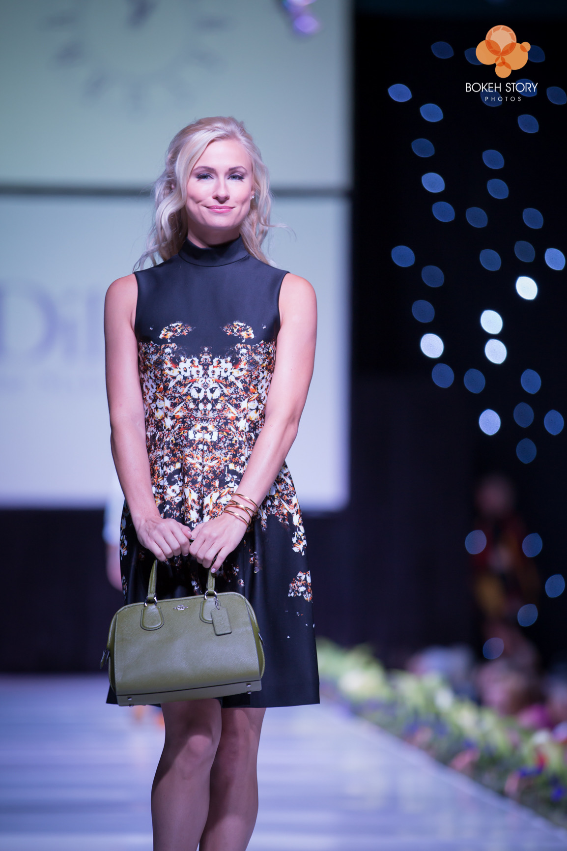 Adorn Style Show runway photography, model in white ballgown, Kansas City fashion event